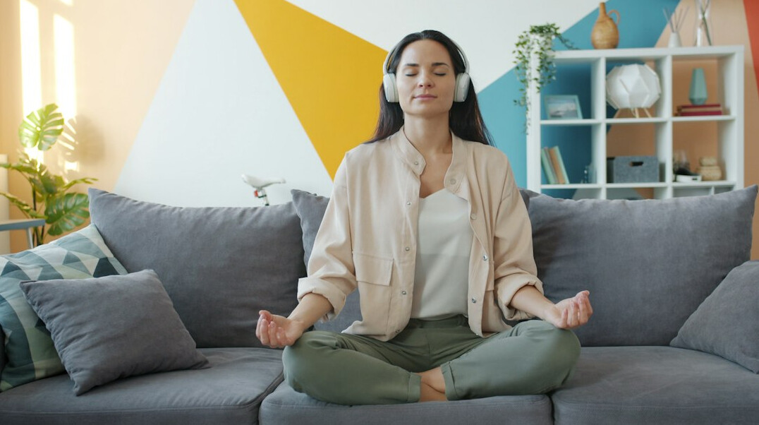 person meditating in calm room