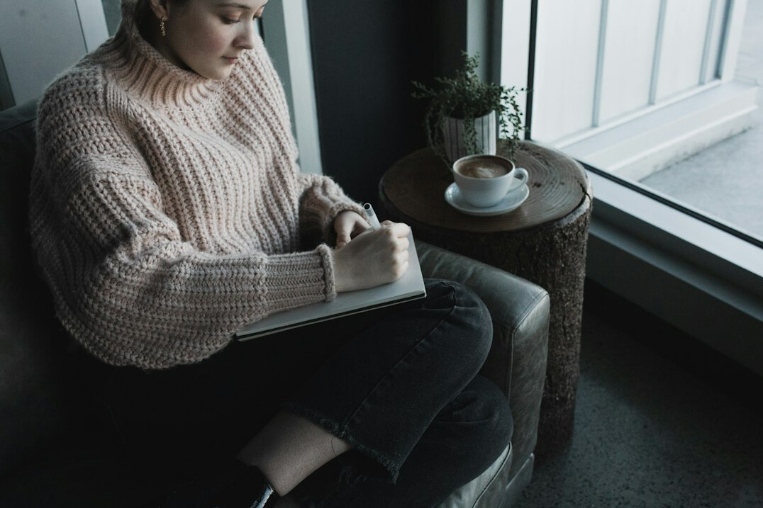 person journaling in morning