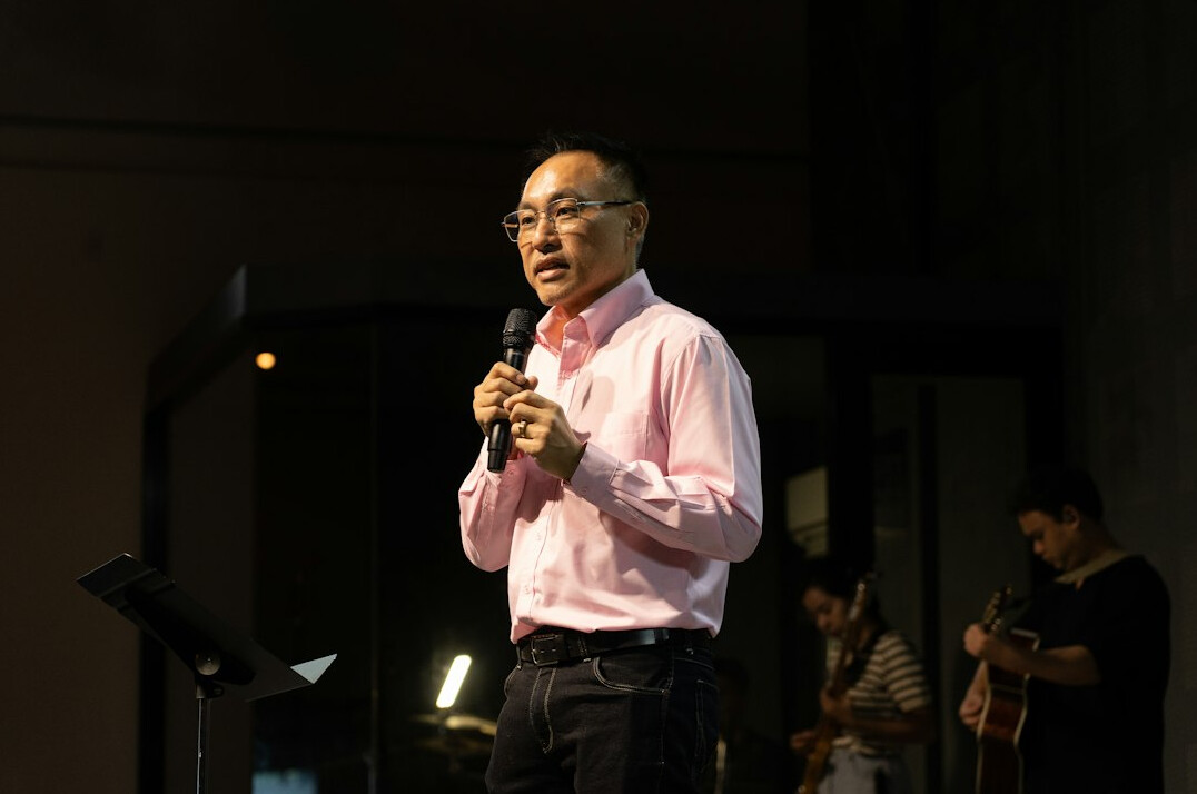 person giving speech on stage